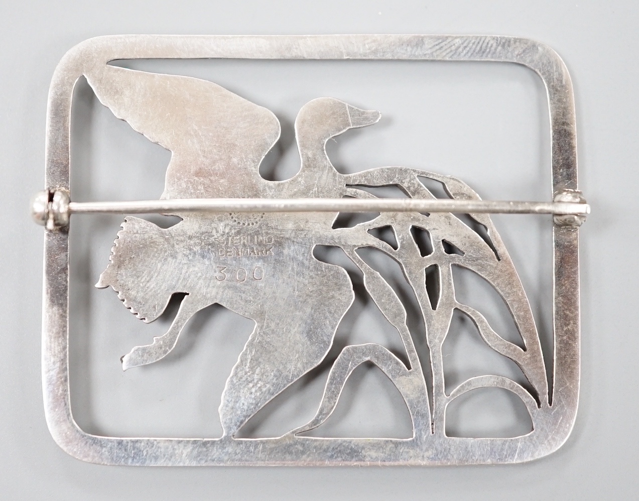 A Georg Jensen sterling 'duck in flight amid reeds' rectangular brooch, no. 300, 47mm.